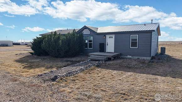 6.19 Acres of Land with Home for Sale in Carr, Colorado