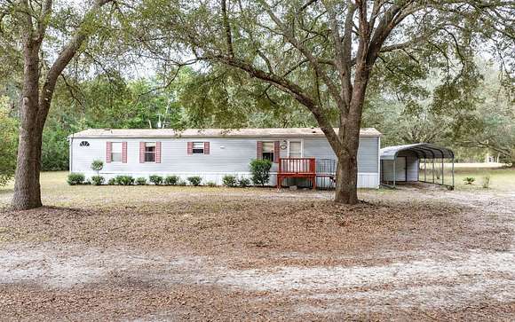 7.84 Acres of Residential Land with Home for Sale in Fort White, Florida