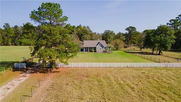 9.817 Acres of Land with Home for Sale in Magnolia, Texas