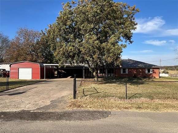 6.37 Acres of Residential Land with Home for Auction in Stigler, Oklahoma