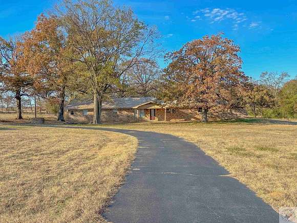 9.44 Acres of Land with Home for Sale in De Kalb, Texas