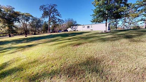 3.723 Acres of Residential Land with Home for Sale in Hallsville, Texas