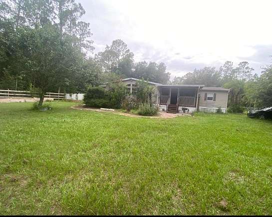 4.98 Acres of Residential Land with Home for Sale in Polk City, Florida