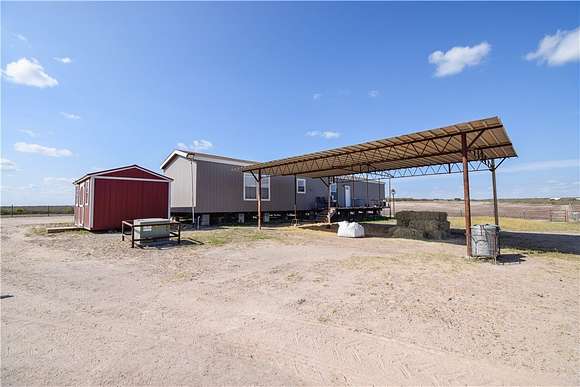 22.7 Acres of Agricultural Land with Home for Sale in George West, Texas