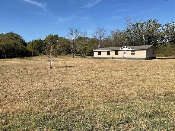 7.04 Acres of Residential Land with Home for Sale in Terrell, Texas