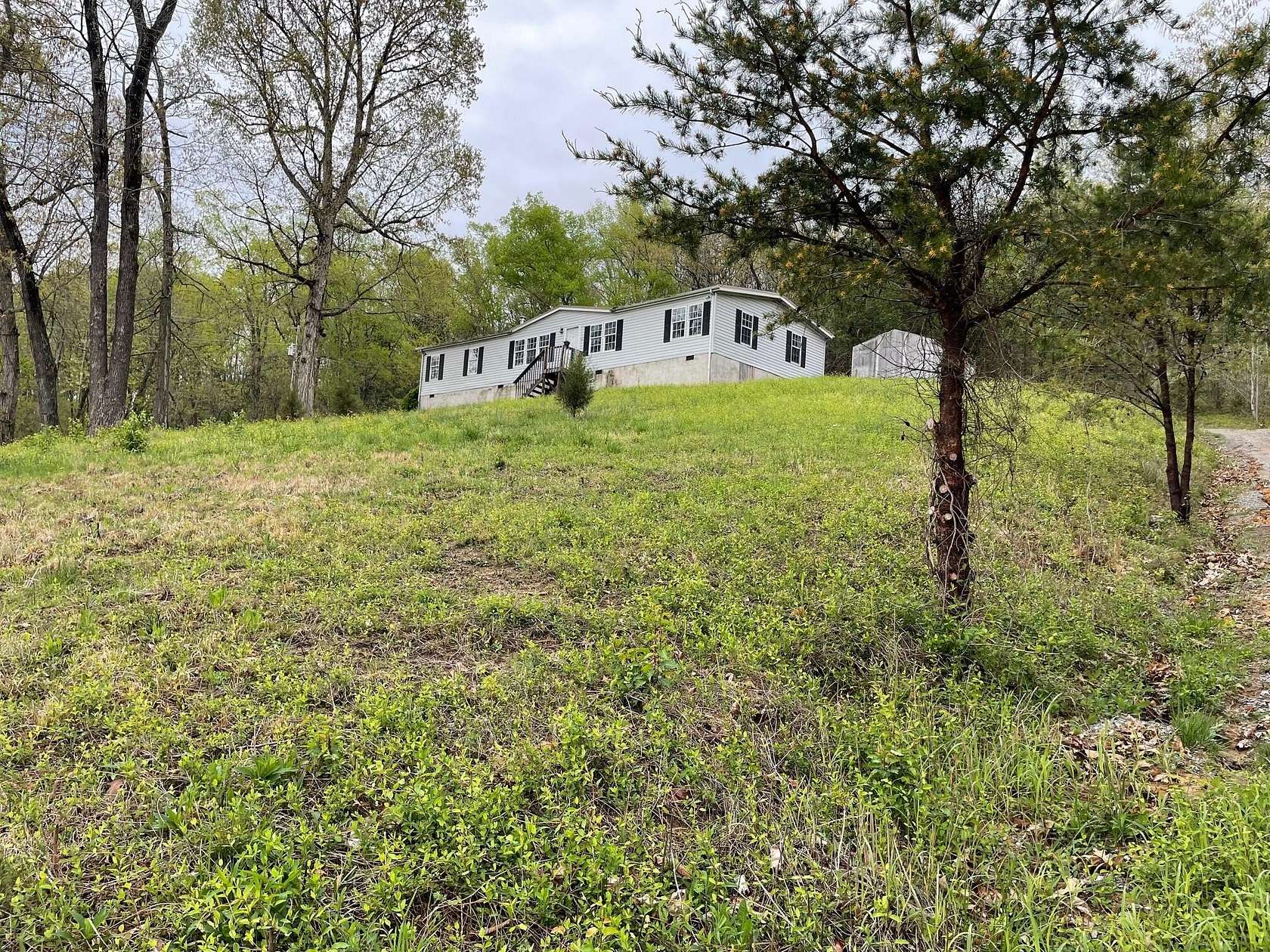 5.2 Acres of Residential Land with Home for Sale in Dandridge, Tennessee