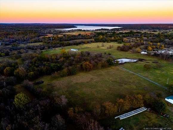 80 Acres of Agricultural Land with Home for Sale in Locust Grove, Oklahoma