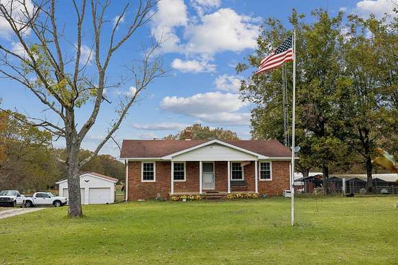 56.12 Acres of Land with Home for Sale in Hollow Rock, Tennessee