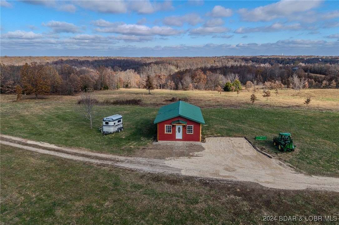 73.77 Acres of Recreational Land with Home for Sale in Camdenton, Missouri