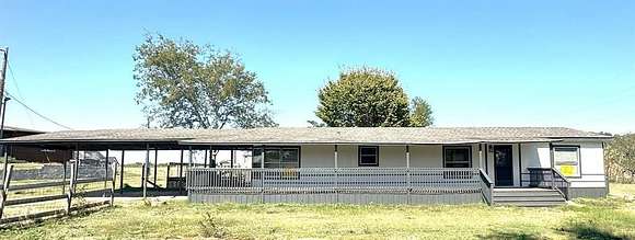 5 Acres of Residential Land with Home for Sale in Greenville, Texas