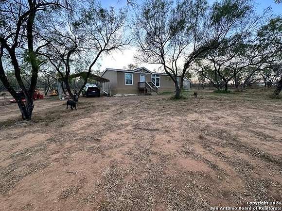 14.056 Acres of Land with Home for Sale in Jourdanton, Texas