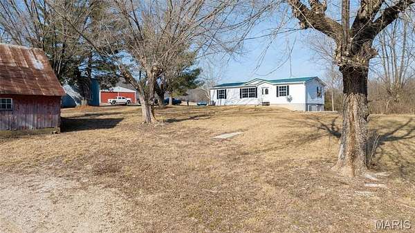 138 Acres of Recreational Land with Home for Sale in Boone Township, Missouri
