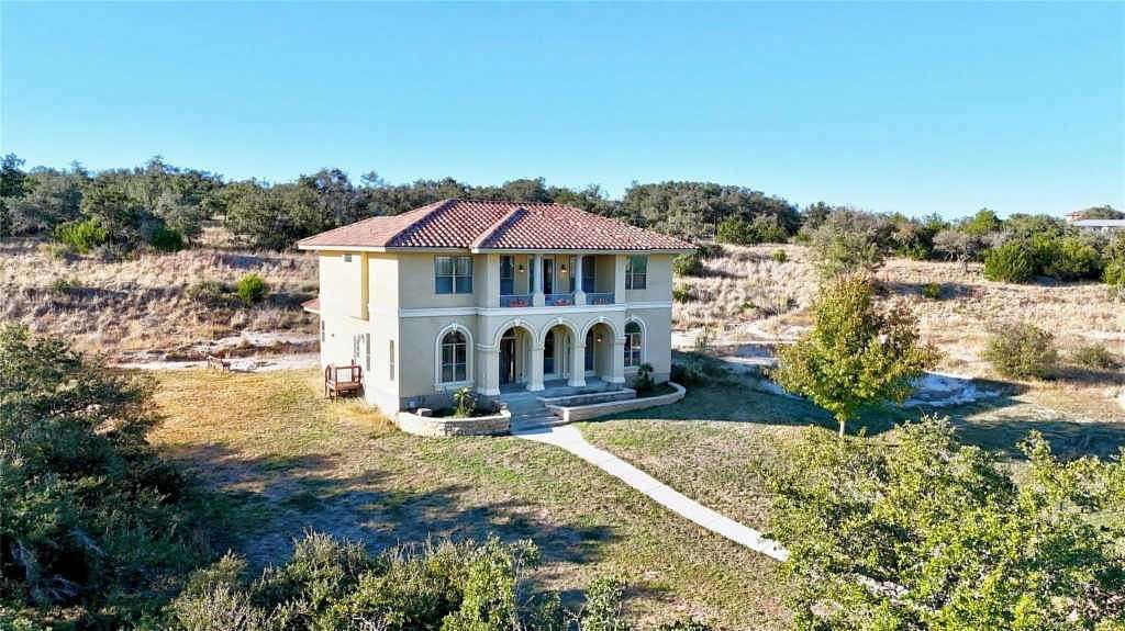 11.133 Acres of Land with Home for Sale in Dripping Springs, Texas