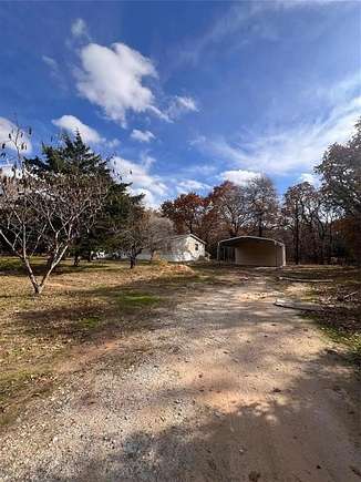 2 Acres of Residential Land with Home for Sale in Covington, Texas