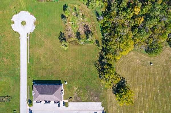 0.52 Acres of Commercial Land for Sale in Peculiar, Missouri