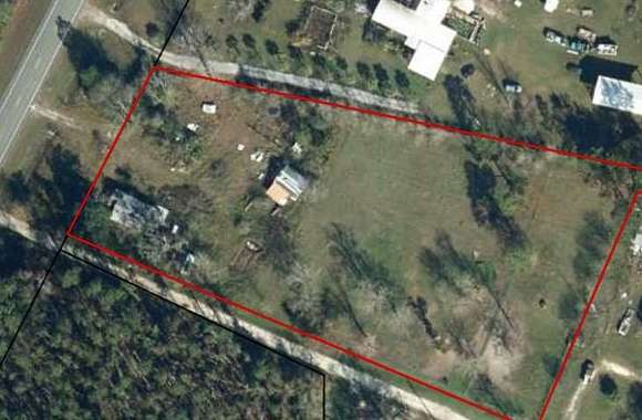 2.8 Acres of Residential Land with Home for Sale in Wewahitchka, Florida