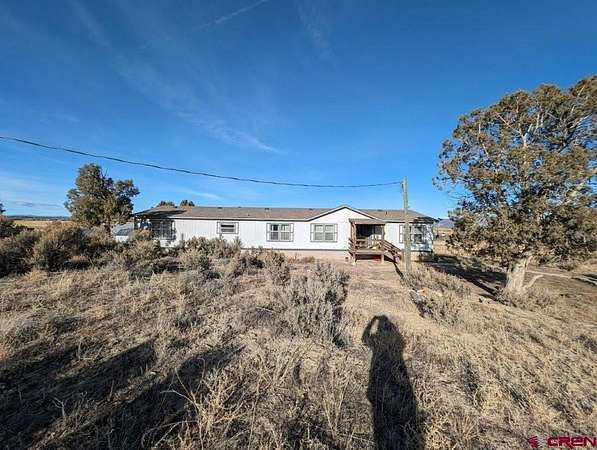 20 Acres of Land with Home for Sale in Navajo Dam, New Mexico