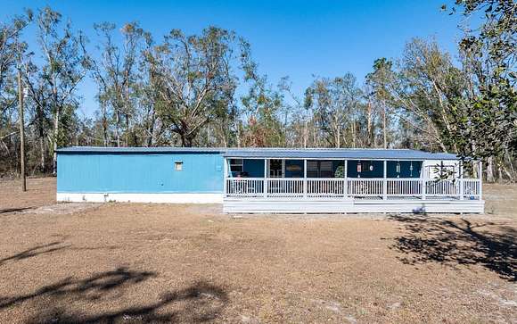 9.63 Acres of Land with Home for Sale in Live Oak, Florida