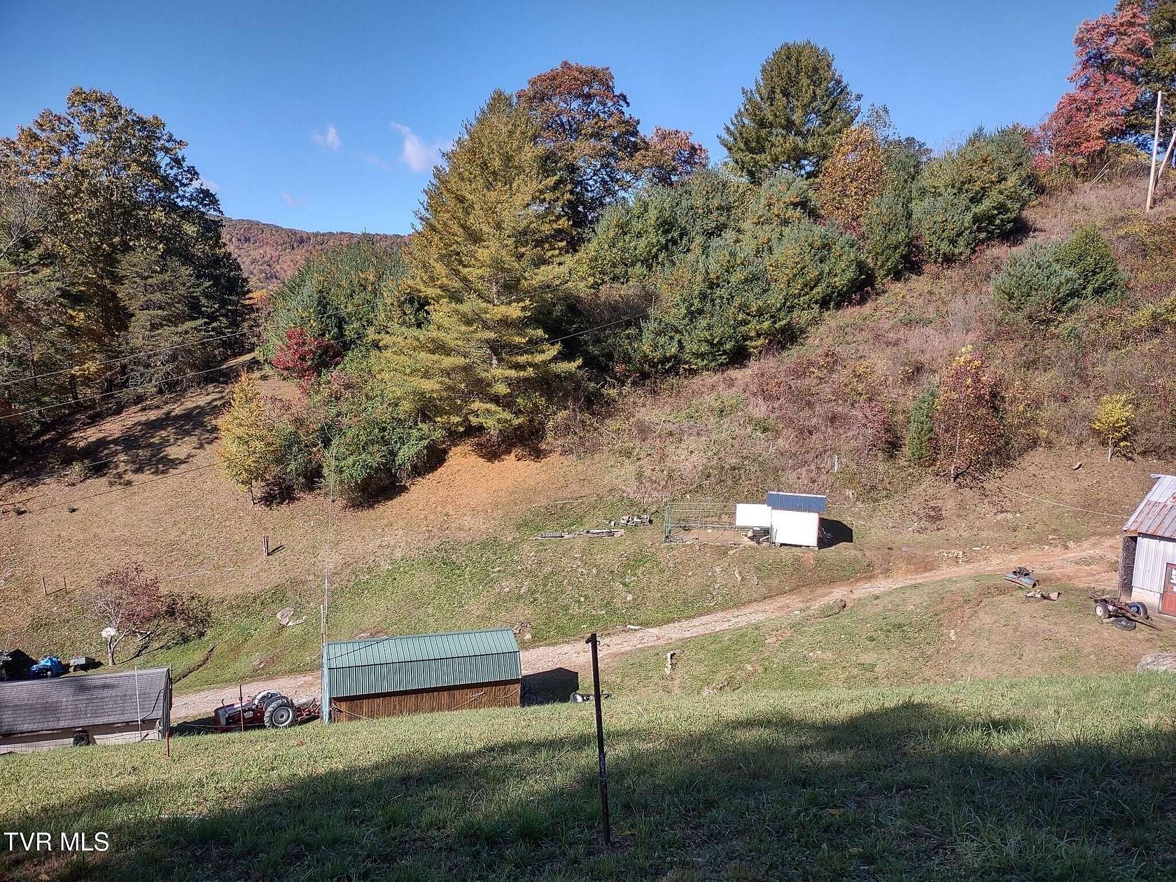 6.61 Acres of Residential Land with Home for Sale in Roan Mountain, Tennessee