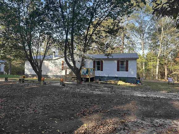 15.13 Acres of Land with Home for Sale in Roberta, Georgia