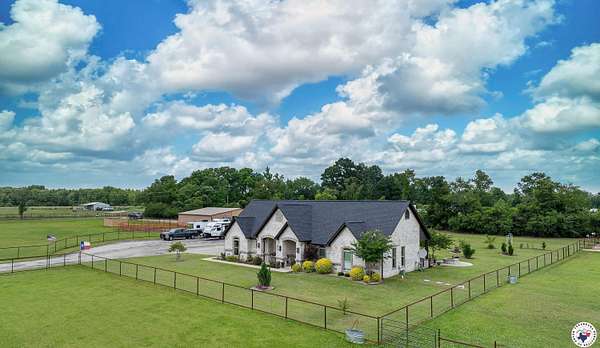 6.73 Acres of Land with Home for Sale in Avery, Texas