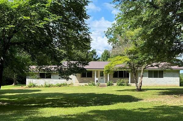 154 Acres of Recreational Land with Home for Sale in Shelbyville, Texas