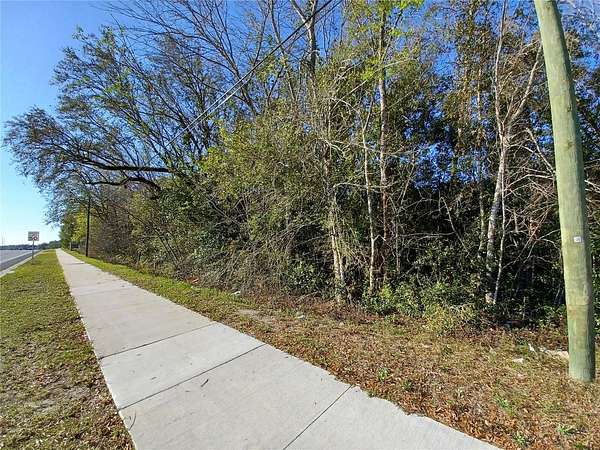 0.78 Acres of Commercial Land for Sale in Lady Lake, Florida