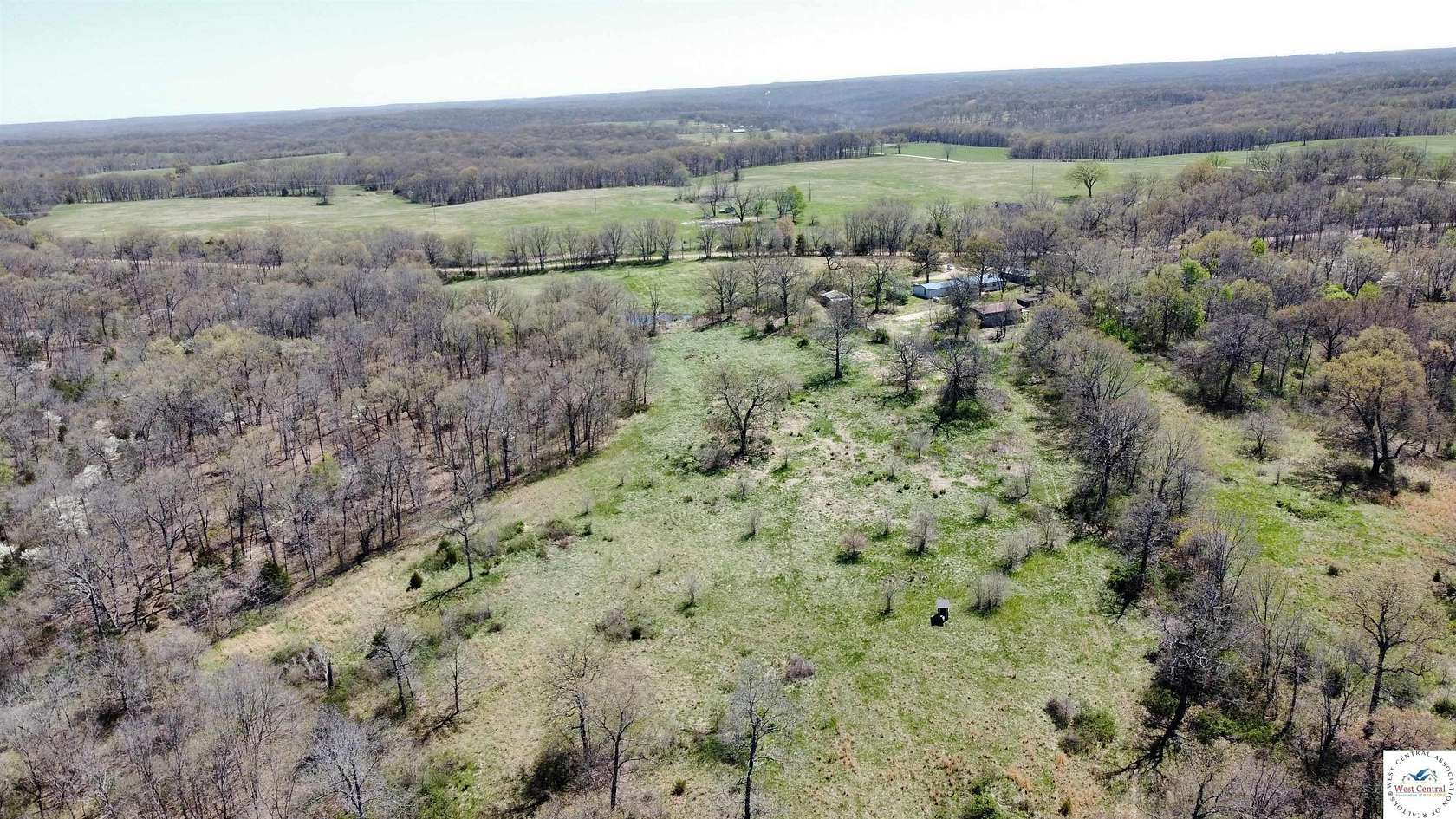 156 Acres of Agricultural Land with Home for Sale in Edwards, Missouri