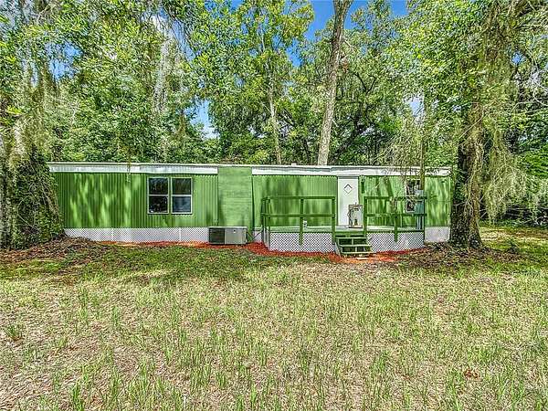5.6 Acres of Land with Home for Sale in Micanopy, Florida