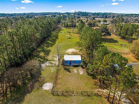 6.67 Acres of Land with Home for Sale in Reddick, Florida