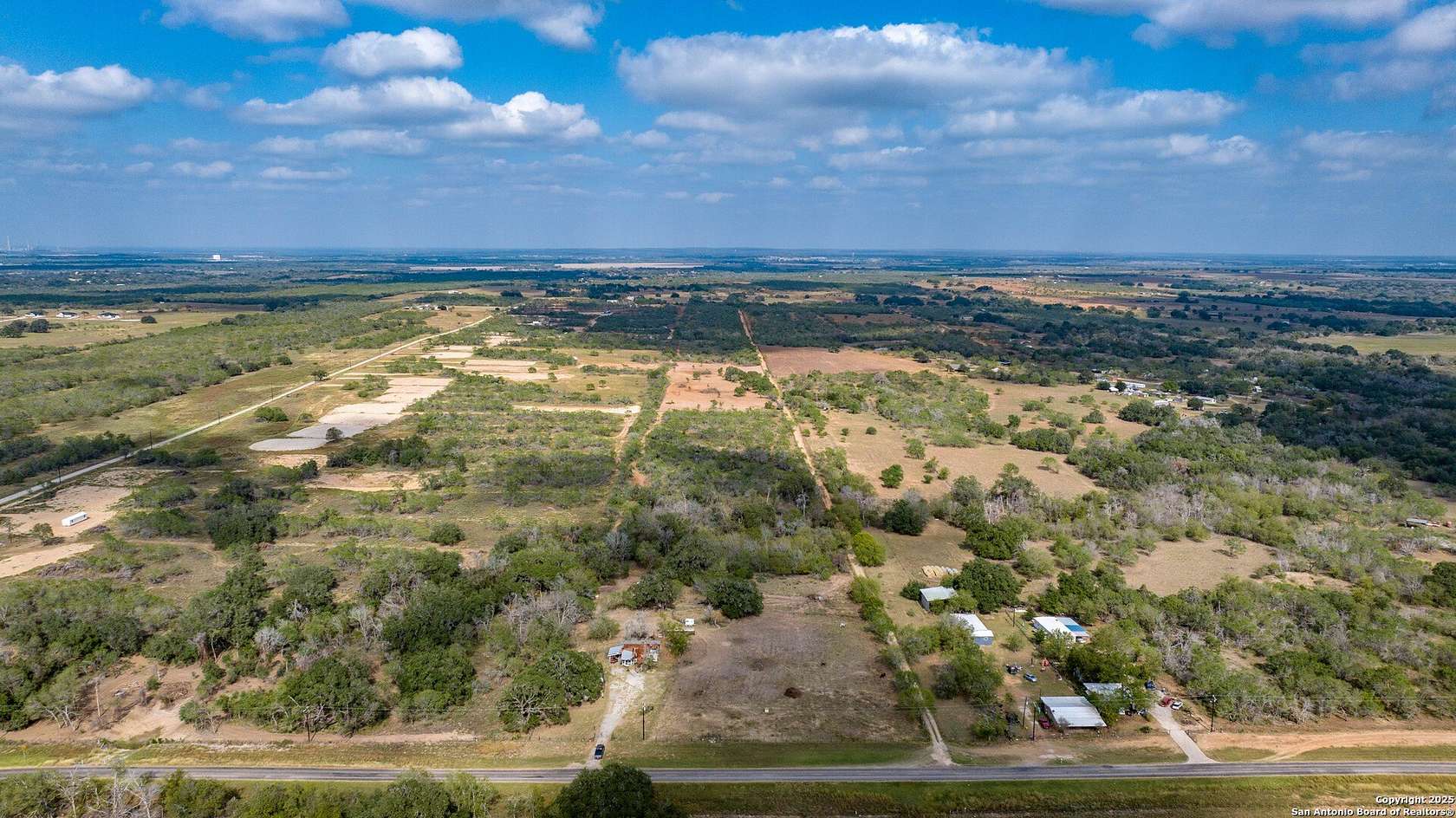 64.9 Acres of Agricultural Land with Home for Sale in Floresville, Texas