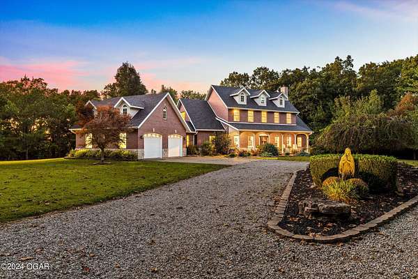 145 Acres of Agricultural Land with Home for Sale in Aurora, Missouri