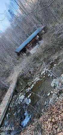 20.6 Acres of Land with Home for Sale in Sevierville, Tennessee