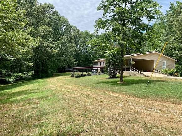 10.14 Acres of Land with Home for Sale in Cottage Grove, Tennessee