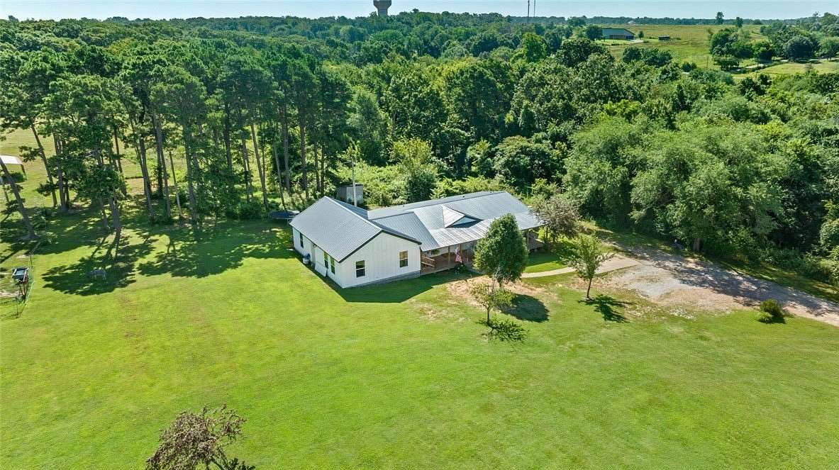22.5 Acres of Land with Home for Sale in Gravette, Arkansas