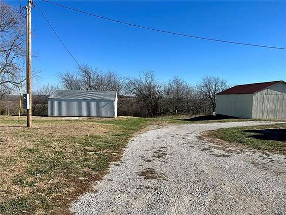 13.23 Acres of Land with Home for Sale in Odessa, Missouri