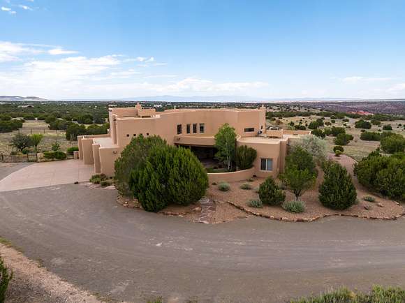 10 Acres of Residential Land with Home for Sale in Sandia Park, New Mexico