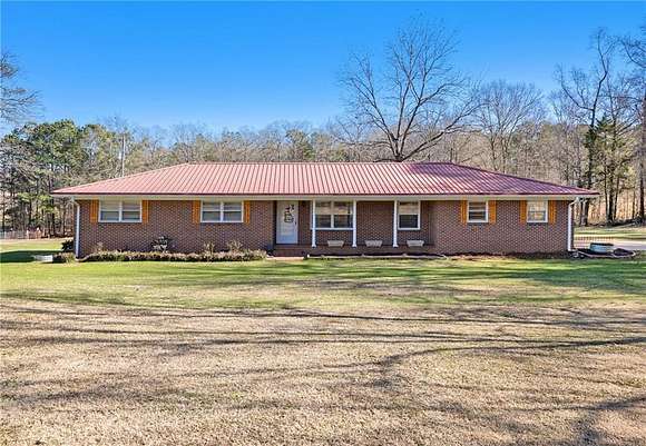 12.27 Acres of Land with Home for Sale in Milner, Georgia