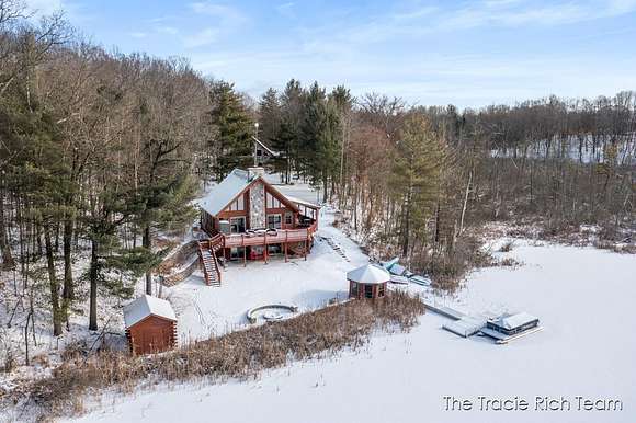 63 Acres of Land with Home for Sale in Trufant, Michigan