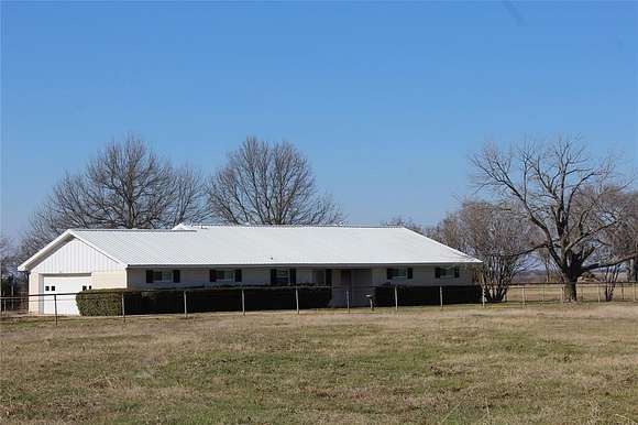 5 Acres of Land with Home for Sale in Wolfe City, Texas