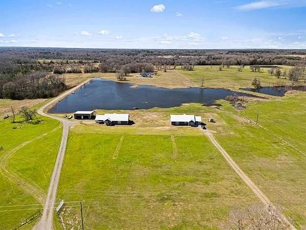 16.3 Acres of Recreational Land with Home for Sale in Pittsburg, Texas