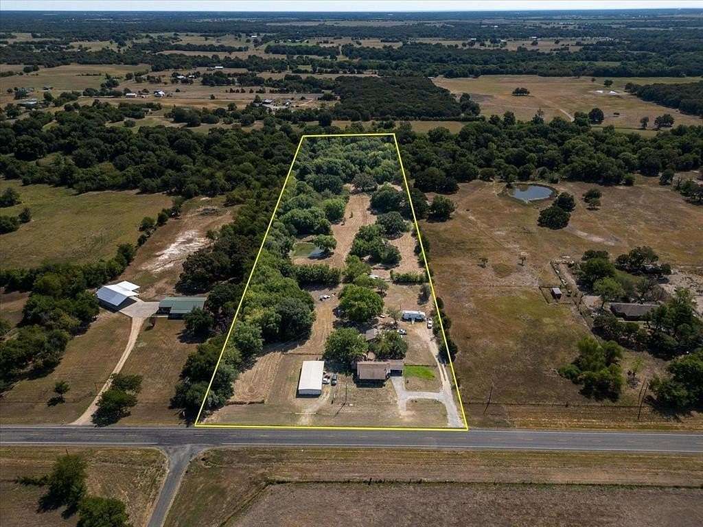 9 Acres of Residential Land with Home for Sale in Wolfe City, Texas
