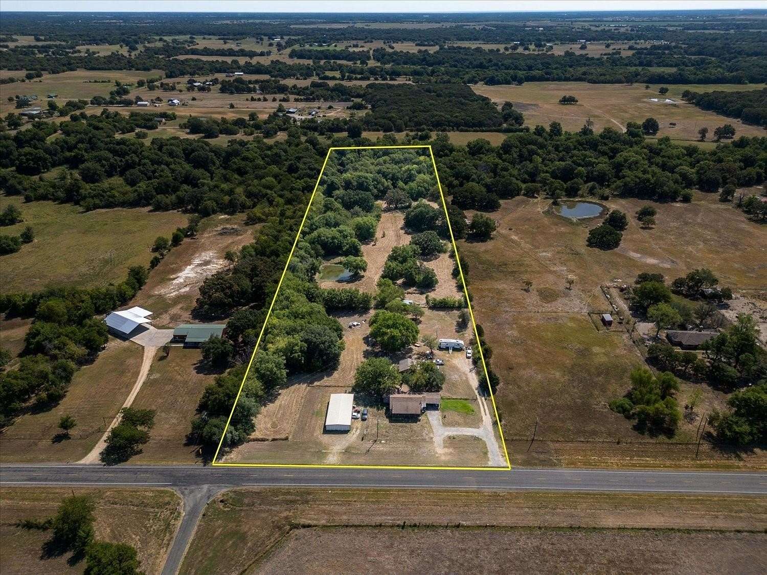 9 Acres of Land with Home for Sale in Wolfe City, Texas