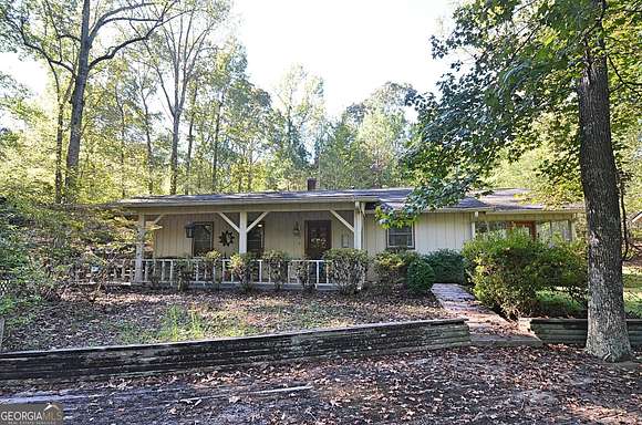 6.58 Acres of Land with Home for Sale in Conyers, Georgia