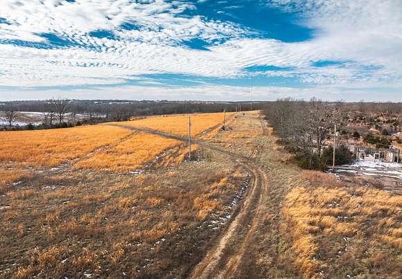 129 Acres of Recreational Land & Farm for Sale in Macks Creek, Missouri