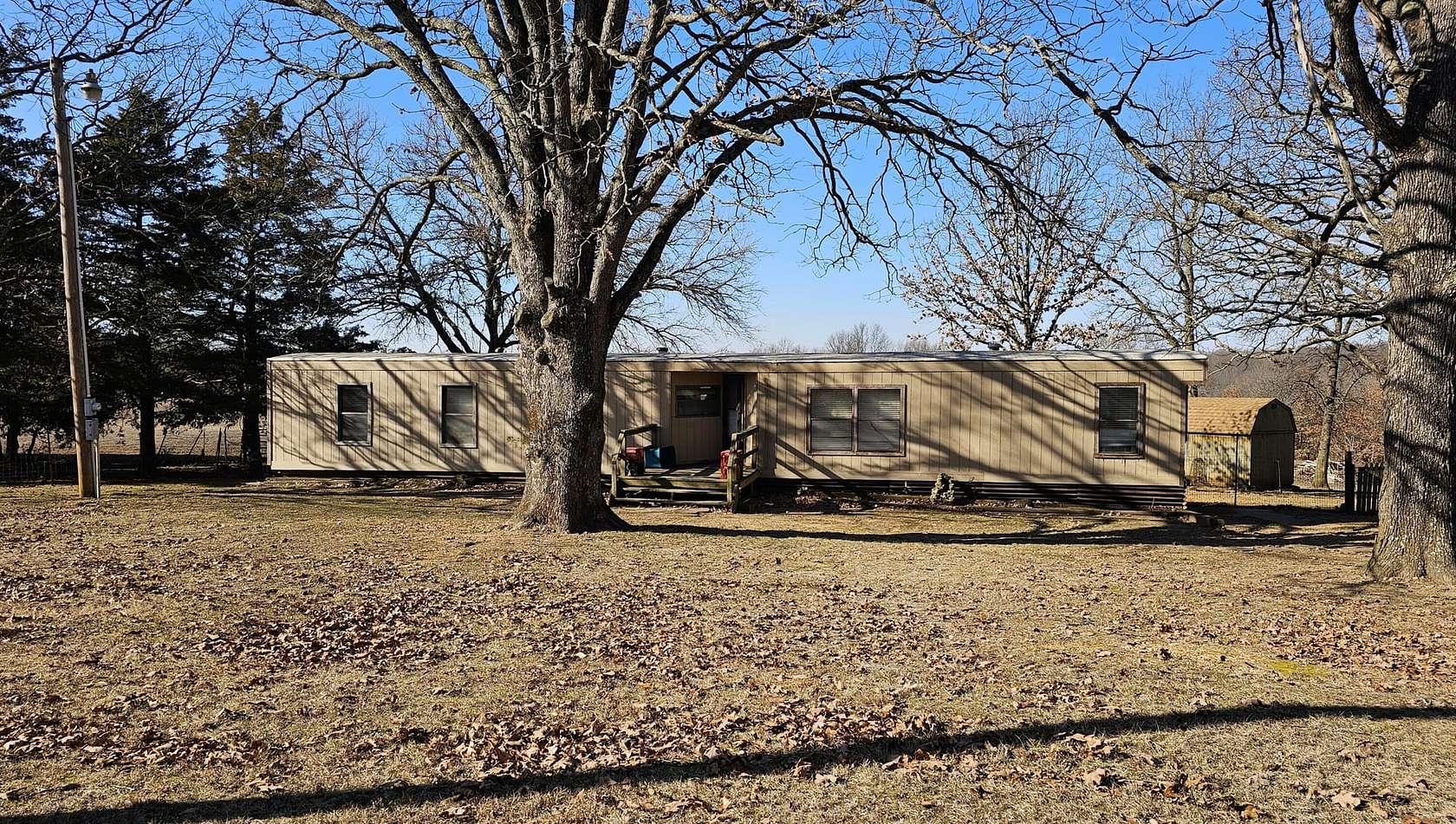 82 Acres of Land with Home for Sale in Humansville, Missouri