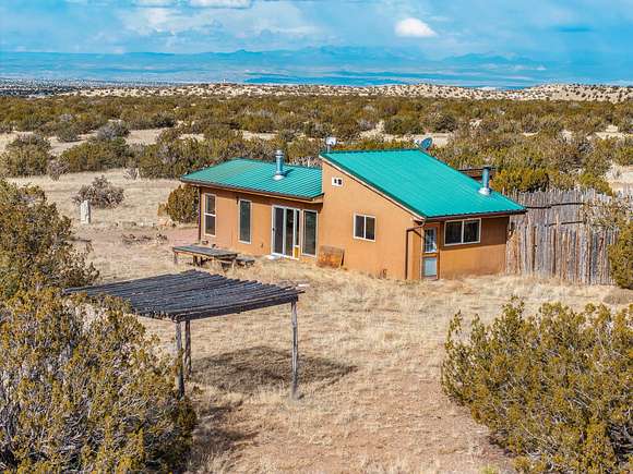 30 Acres of Recreational Land with Home for Sale in Madrid, New Mexico