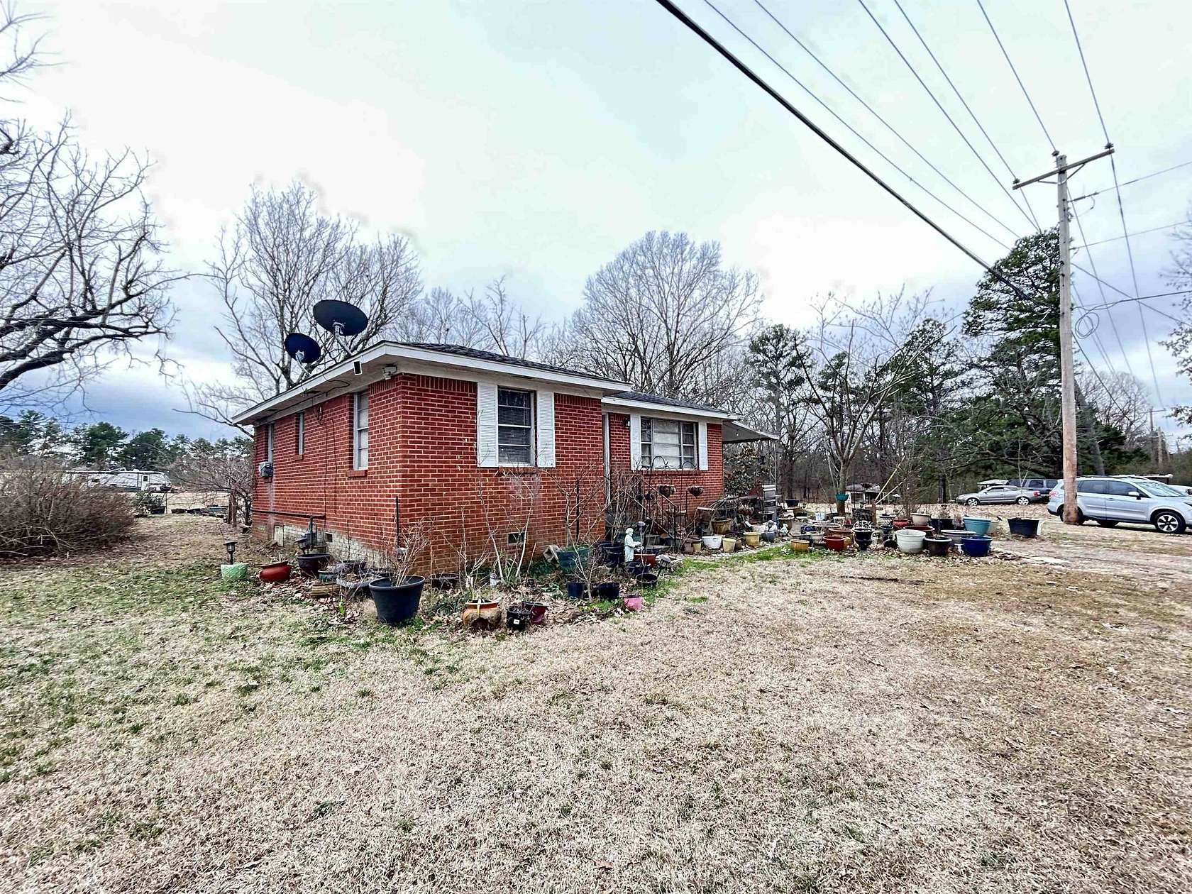 10.7 Acres of Land with Home for Sale in Eads, Tennessee