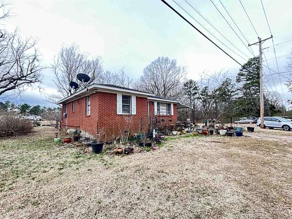 10.7 Acres of Land with Home for Sale in Eads, Tennessee