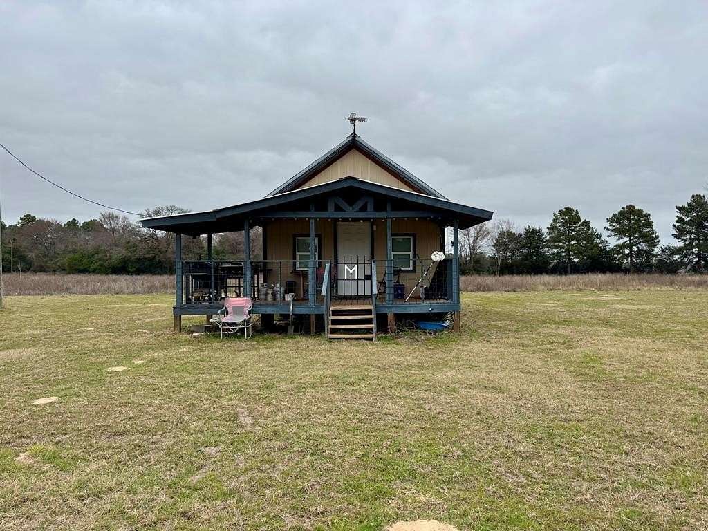 4.84 Acres of Residential Land with Home for Sale in Grapeland, Texas